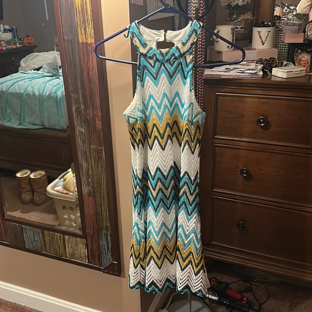 A white, teal, gold, navy blue dress